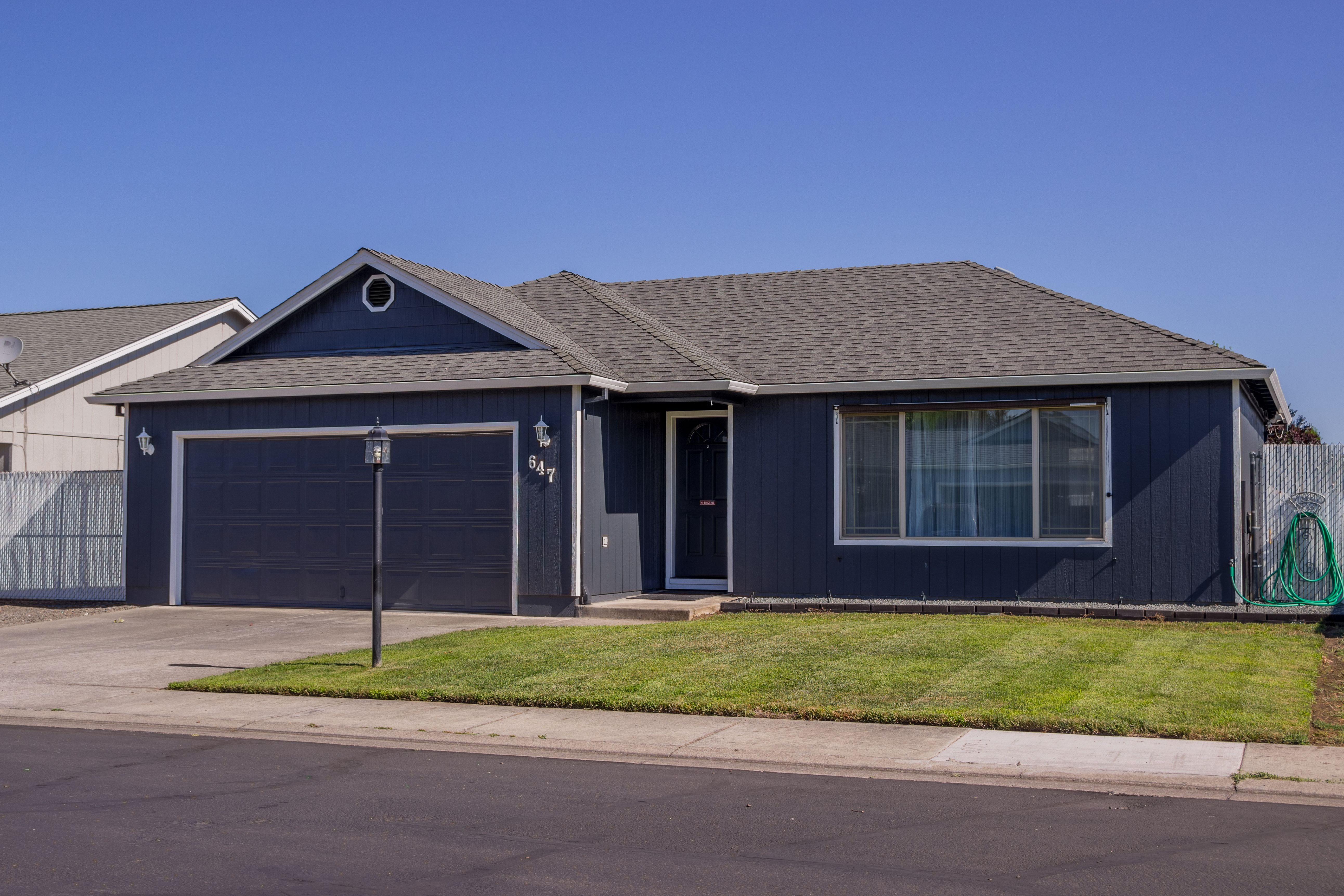 Single-story residential house exterior, mood stock